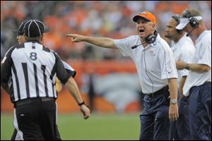 Denver Broncos head coach John Fox, right, shouts to the referee in the fourth quarter of an NFL football game against the Houston Texans, Sunday, Sept. 23, 2012, in Denver.