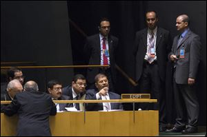 Egyptian President Mohamed Morsi sits with his delegation before addressing the 67th United Nations General Assembly, at U.N. headquarters Wednesday