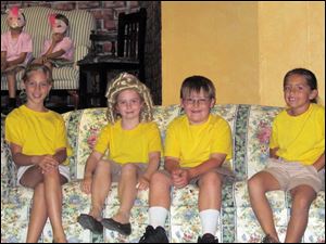From left, Leah Pitman, Meggie Mello, Levi Myers and Autumn Pelok - Mama Locks, Goldie Locks, Papa Locks and Raven Locks - in a production of 
