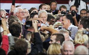 Republican Presidential candidate Mitt Romney greets supporters Wednesday, at the SeaGate Centre.