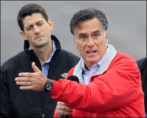 Republican presidential candidate Mitt Romney speaks during a campaign rally Tuesday with his running mate Rep. Paul Ryan, R-Wis.,  at Wright Brothers Aviation in Vandalia, Ohio. 