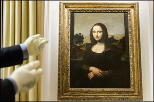 A painting attributed to Leonardo da Vinci and representing Mona Lisa is seen during a preview presentation in a vault in Onex near Geneva, Wednesday.