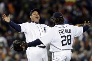 Detroit Tigers' Miguel Cabrera, left, and Prince Fielder (28) celebrate their 5-4 win over the Kansas City Royals in a baseball game in Detroit on Wednesday.