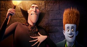 Dracula, voiced by Adam Sandler, left, and Johnnystein, voiced by Andy Samberg in a scene from 