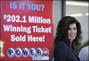 Iowa Lottery spokesperson Mary Neubauer speaks during a news conference outside the Casey's General Store, Thursday, Sept. 27, 2012, in Bondurant, Iowa. 