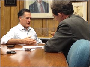 Republican candidate for president Mitt Romney speaks with Blade politics writer Tom Troy on Wednesday.
