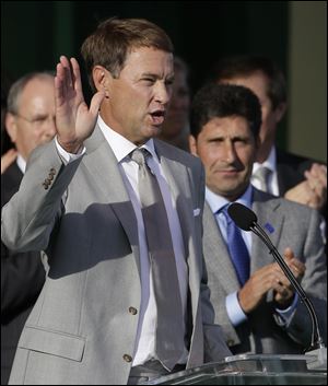 European team captain Jose Maria Olazabal, right, watches as USA's captain Davis Love III speaks during the opening ceremony Thursday at the Ryder Cup PGA golf tournament at Medinah Country Club in Medinah, Ill.