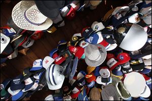 Hats hang from the garage at the home of Lee McBride.