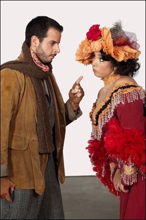 Lee Poulis, left, as Marcello and Jennifer Rowley as Muscetta in 'La Boheme.'