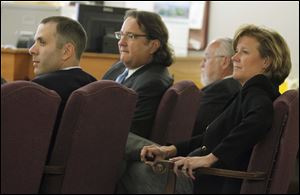 From left: defendants Tony Packo III and Cathleen Dooley, with attorneys Mark Jacobs and Rick Kerger, during the Packo criminal trial Friday.