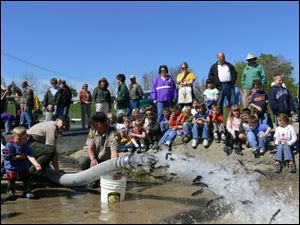 Earlier this year, students from the Vermilion area watched as Division of Wildlife personnel stocked yearling steelhead trout produced at the Castalia State Fish Hatchery into the Vermilion river.
