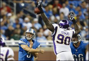 Minnesota Vikings nose tackle Fred Evans (90) blocks a pass by Detroit Lions quarterback Matthew Stafford (9) during the second half at Ford Field in Detroit on Sunday.