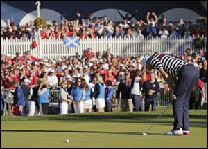 USA's Jim Furyk reacts after missing a putt on the 18th hole and losing to Europe's Sergio Garcia during a singles match at the Ryder Cup PGA golf tournament Sunday.