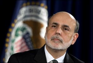 Federal Reserve Chairman Ben Bernanke, shown at an earlier event, offered a sharp defense today of the Federal Reserve's bold policies to stimulate the weak economy.