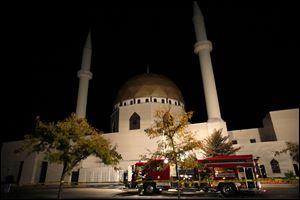 Firefighter work to find the source of reported smoke at the Islamic Center in Perrysburg on Sunday.