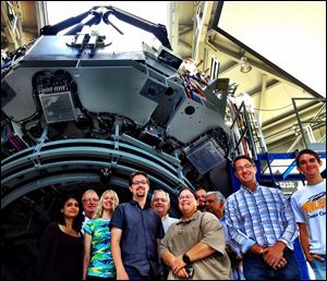 Representatives of UT's astronomy team at Lowell Observatory outside of Flagstaff, Arizona. From left to right, Dr. Rupali Chandar, associate professor of astronomy, Dr. William McMillen, provost and executive vice president for academic affairs, Lesley Simanton, 4rd year graduate student in physics and astronomy, Dr. Michael Cushing, assistant professor of astronomy and director of the Ritter Planetarium, Joe Zerbey, UT Trustee, Dr. Karen Bjorkman, dean of the College of Natural Sciences and Mathematics, distinguished university professor of astronomy, Carl Starkey, 5th year graduate student in physics and astronomy, Dr. S. Amjad Hussain, UT Trustee, Dr. J.D. Smith, assistant professor of astronomy, Adam Smercina, sophomore undergraduate student in physics and astronomy.  All the doctors are PhDs, except for Dr. Hussain, who is an MD.
