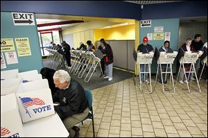 Lucas County residents take the opportunity to vote early at the Early Voting Center set up in Summit Center, former Riverside Hospital, on Summit Street in North Toledo.