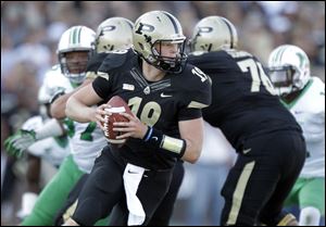 Purdue quarterback Caleb TerBush drops back to throw against Marshall earlier this season.