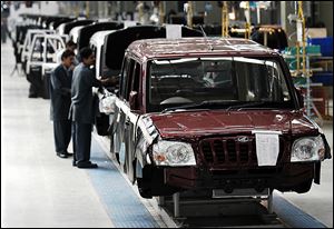 A Mahindra Scorpio moves down a production line at a plant in Nashik, India. Mahindra Motors plans to sell a sport utility vehicle similar to the Scorpio in the U.S. in the coming years.