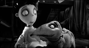Victor Frankenstein, voiced by Charlie Tahan, with Sparky, in a scene from 