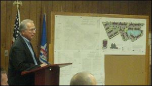 George Oravecz, consulting engineer for Redwood Development, discusses plans for the next phase of the Barrington Place subdivision Wednesday at the Perrysburg Township trustee meeting. 
