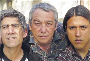Mike Watt, center, with Tom Watson, left and Raul Morales of the band Missingmen.