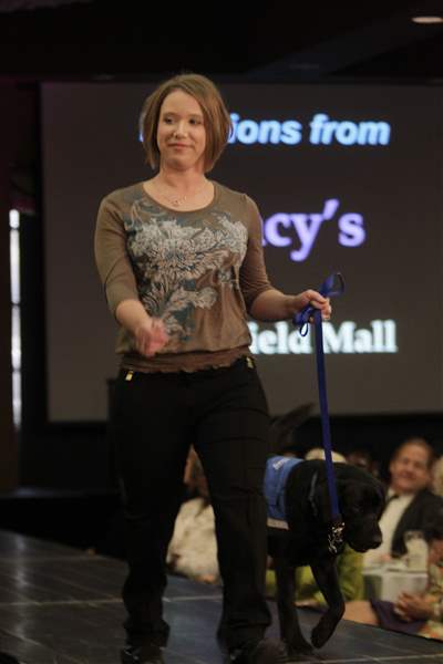 Amanda-Holewinski-on-the-runway-with-an-assistance-dog