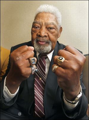 Emerson Cole shows off his Hall of Fame University of Toledo ring on the left hand, and his World Champion Cleveland Browns ring on the right.