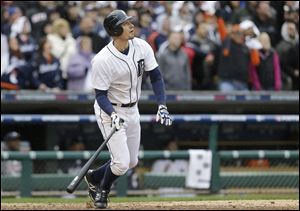Detroit Tigers' Don Kelly watches his game-winning sacrifice fly to score teammate Omar Infante during the ninth inning of Game 2 on Sunday.