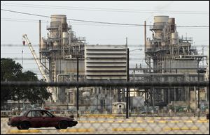 A car enters an employee parking lot at BPs Texas City refinery in Texas City, Texas. BP announced that it has found a buyer for its Texas City refinery, one of the largest and most complex in the U.S.