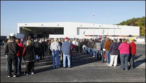 People lineup to attend a campaign rally for  Republican vice-presidential candidate Paul Ryan, in a Grand Aire hangar at Toledo Express Airport near Swanton. Ryan is the running mate of presidential candidate Mitt Romney.