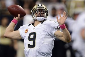 New Orleans Saints quarterback Drew Brees (9) throws a touchdown pass for his 48th consecutive game, breaking Johnny Unitas' NFL record which stood for over 50 years.