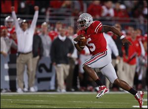 Ohio State quarterback Braxton Miller scores a touchdown against Nebraska on Saturday in Columbus. By winning the highest-scoring game at Ohio Stadium since 1950, OSU (6-0, 2-0 Big Ten) remained the conference’s last unbeaten team, matched its win total from last season, and rose four spots to No. 8 in the AP poll. But more important to coach Urban Meyer, the night represented the first time his vision for the Buckeyes’ no-huddle spread offense began to come to life.