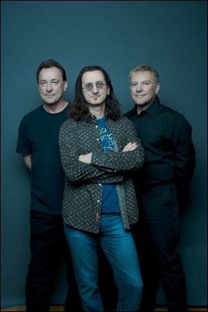 Rush members, from left, Neal Peart, Geddy Lee, and Alex Lifeson.  
