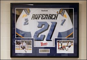 A jersey of Bryan Rufenach is displayed in the locker room. The former Walleye died June 4 in Switzerland.