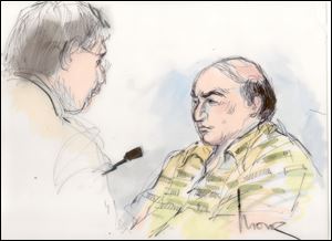 This Sept. 27 file courtroom sketch shows Mark Basseley Youssef, right, talking with his attorney Steven Seiden in court.