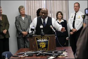 Chief Derrick Diggs, of the Toledo Police Department, discusses the arrest of 11 Beehive gang members during a news conference at the Safety Building.