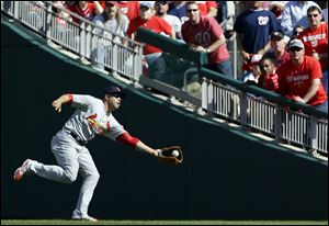 St. Louis Cardinals right fielder Carlos Beltran catches a fly ball Wednesday in Washington.