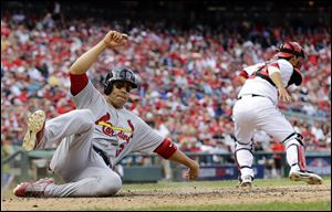 St. Louis Cardinals' Carlos Beltran slides into home plate.