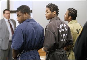 From left to right, Antwaine Jones, James Moore, and Keshawn Jennings, appear in Lucas County Common Pleas Court on Thursday.