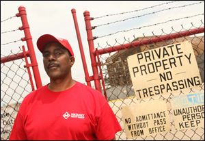 Robert Phason and others at Meridian Rail in Illinois received eight-days notice that the plant, in background, was closing