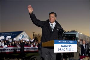 Republican presidential candidate Mitt Romney waves during a campaign rally Wednesday at the Shelby County Fairgrounds in Sidney, Ohio. 