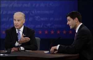 Vice President Joe Biden and Republican vice presidential nominee Paul Ryan, of Wisconsin, speak Thursday during the vice presidential debate at Centre College in Danville, Ky.