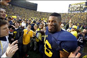 Kevin Koger, seen here in at Michigan Stadium in 2011, is coaching at Saline High School and rehabbing as continues to work on making his NFL dream a reality.