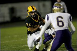 Preston McCurdy, of the Northview Wildcats, runs the ball during the during the second quarter of their game against the The Maumee Panthers.