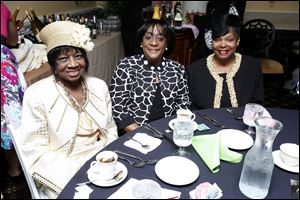 Mary Louise Oakes, Debra Jelks and Mary Dawson, all of Toledo, Ohio, pose for a picture during the Alpha Kappa sorority dance at the Brandywine Country Club in Maumee.