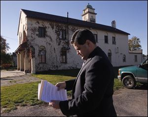 Toledo City Council president Joe McNamara prepares to host a press conference outside Toledo Fire Station 3. The city has already announced that, after a fault was found in the floor, the station would be replaced.