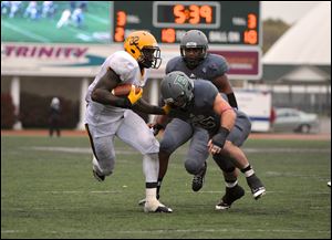 David Fluellen eludes a tackle as he carries the ball in a game that was all offense and short on defense.