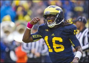 Michigan quarterback Denard Robinson celebrates another touchdown.