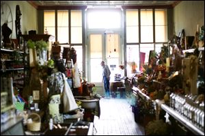 A customer browses through Beeker's General Store in downtown Pemberville.